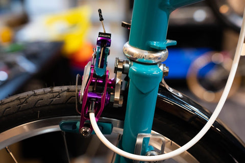 Brake closer to fork to provide maximum braking power and prevent moving